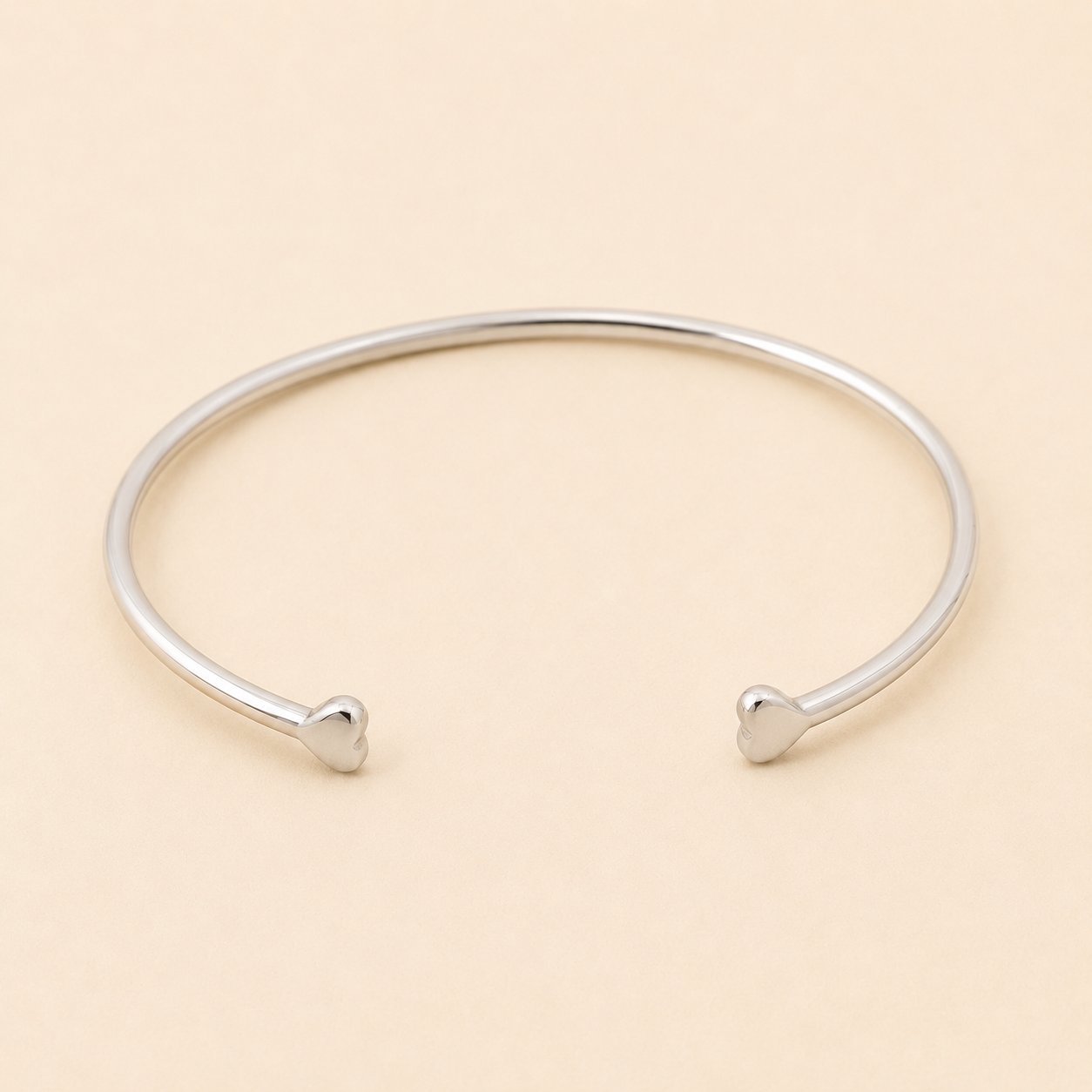 Silver-tone double heart cuff bracelet with two heart-shaped ends