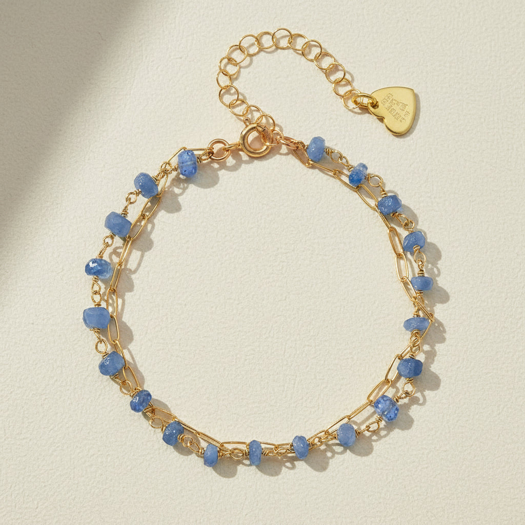 Gold-tone paperclip gemstone bracelet with blue faceted kyanite beads and clasp
