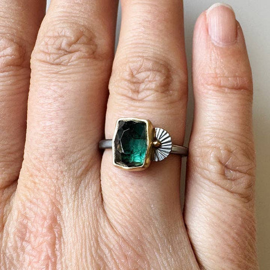 Deep green tourmaline guppy ring with rectangular bezel on silver band