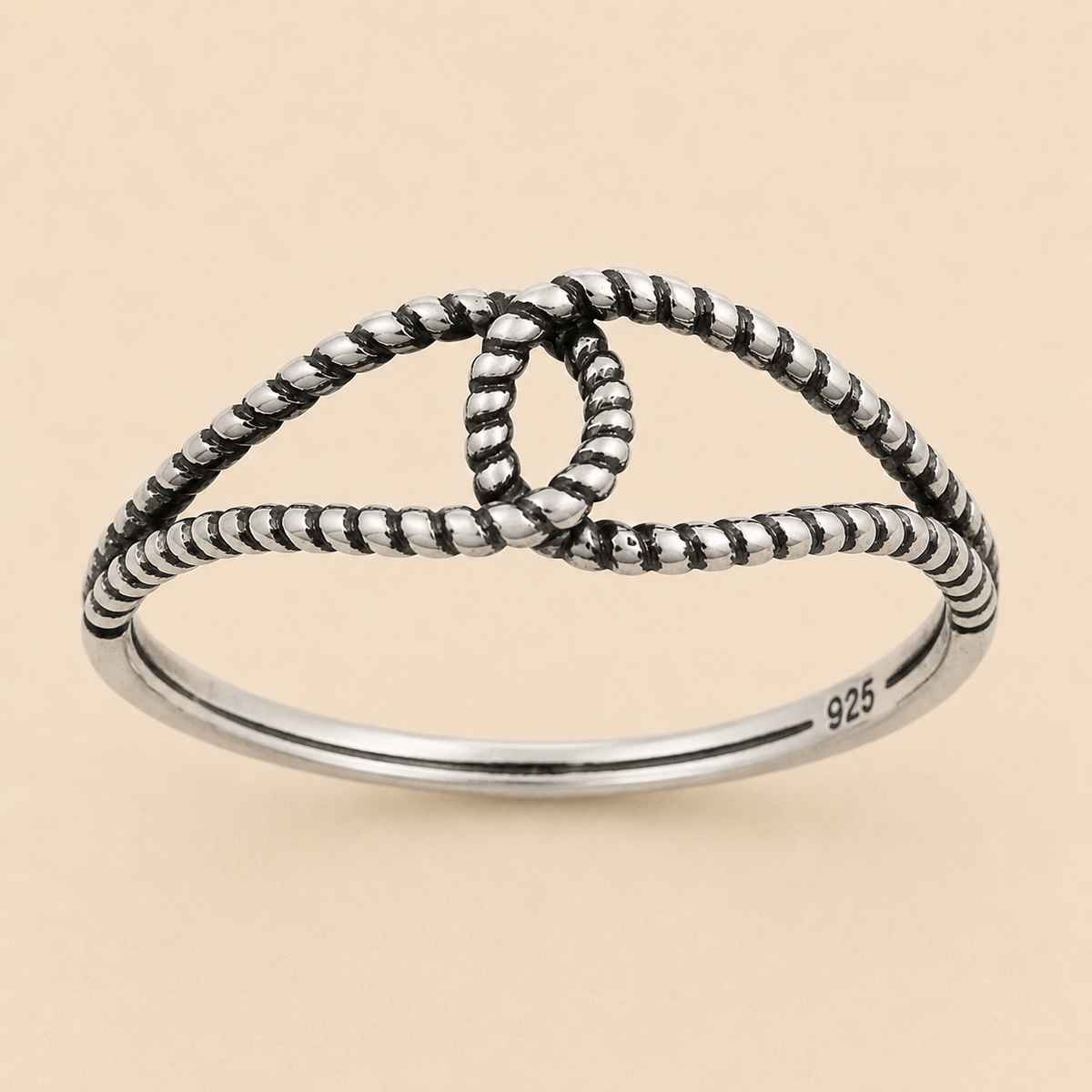 Oxidized knot ring with beaded design and 925 stamp on silver band