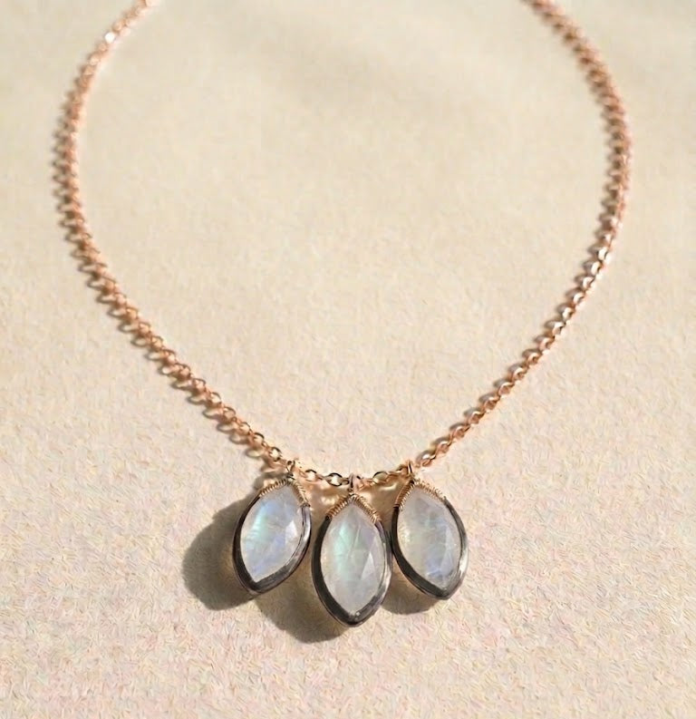Moonstone petal drop necklace with gold chain and three oval stones