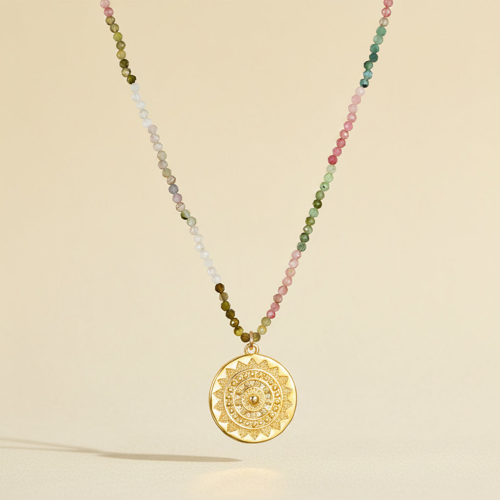 Tourmaline medallion necklace with multicolor beaded strand and round gold engraved pendant