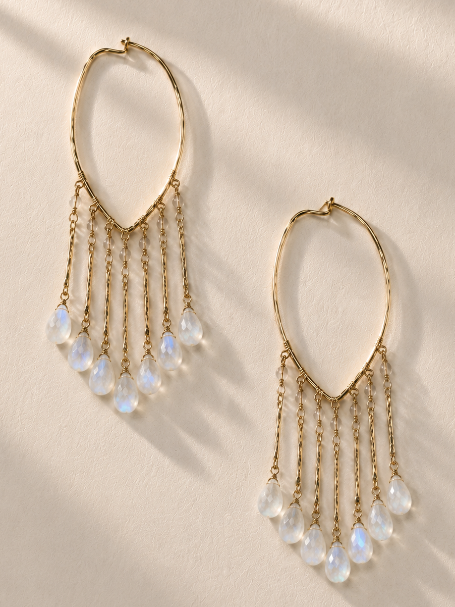Gold hoop earrings with dangling faceted teardrop beads and chain fringe