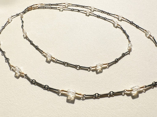 Long two-tone crystal chain necklace with layered silver and dark links