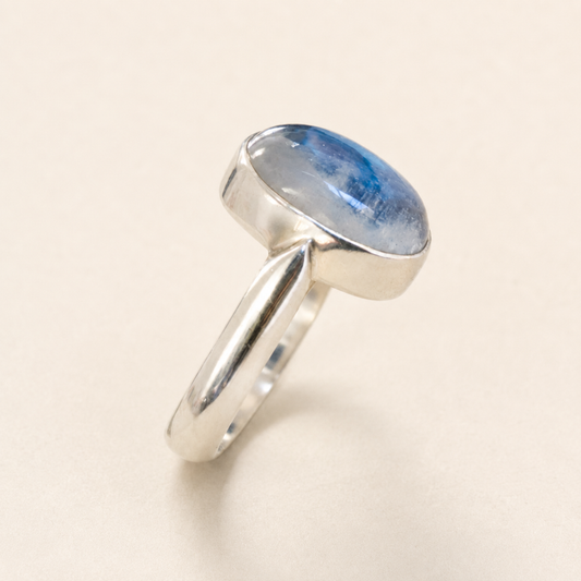 Sterling silver oval moonstone ring with blue cabochon, split-prong band