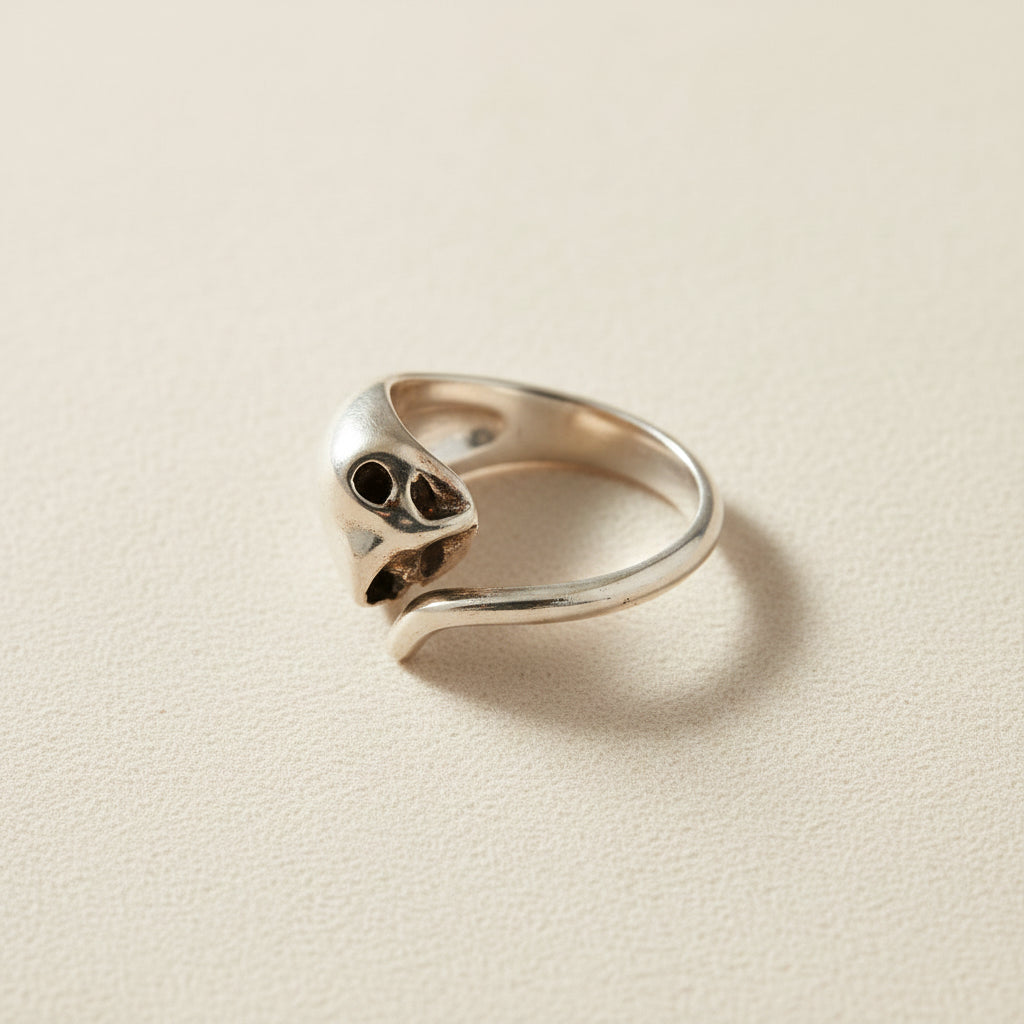 Silver cat ring with open mouth detail and dark round eyes