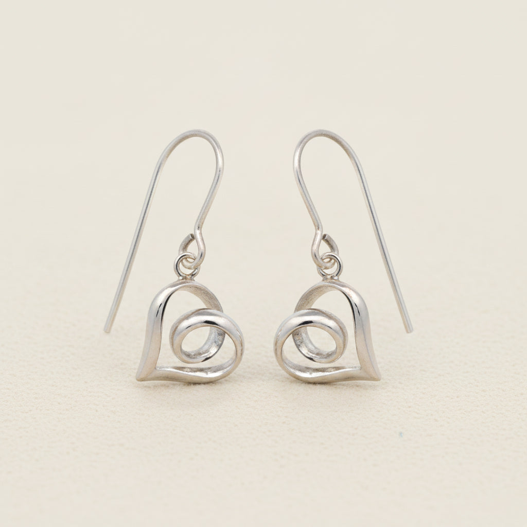 Silver heart dangle earrings with infinity-style loop detail