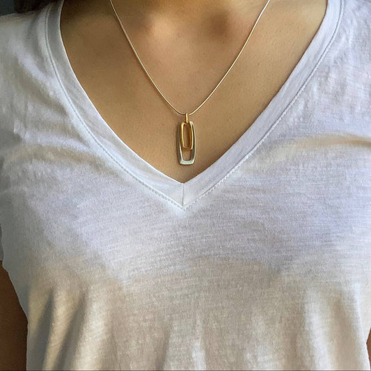 Two-tone rectangular pendant necklace on a thin chain, gold and silver