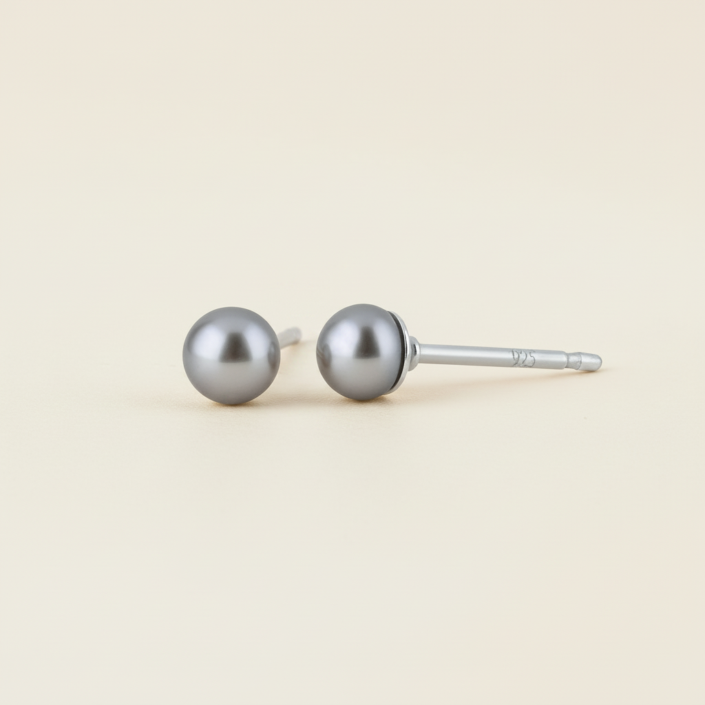 Gray pearl stud earrings with round pearl tops and metal post backs