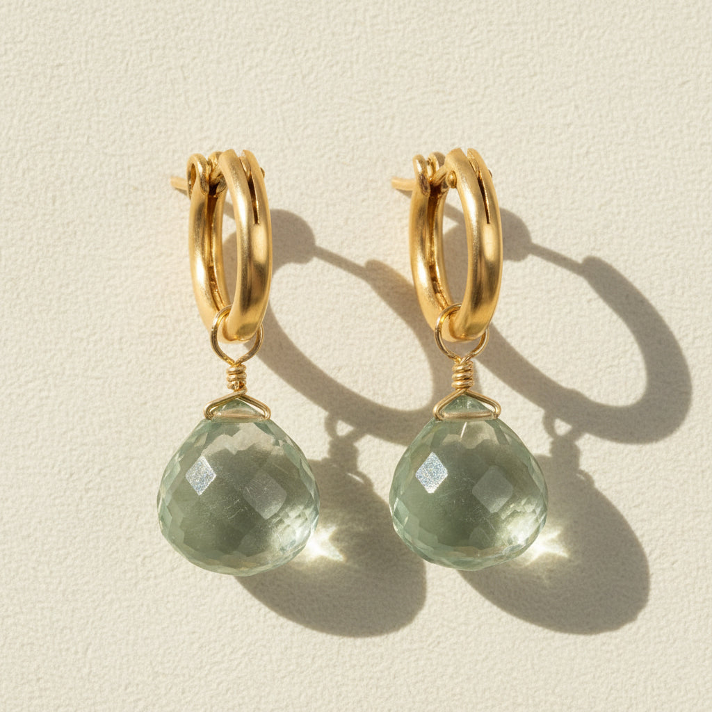 Gold huggie hoop earrings with faceted green amethyst briolette drops