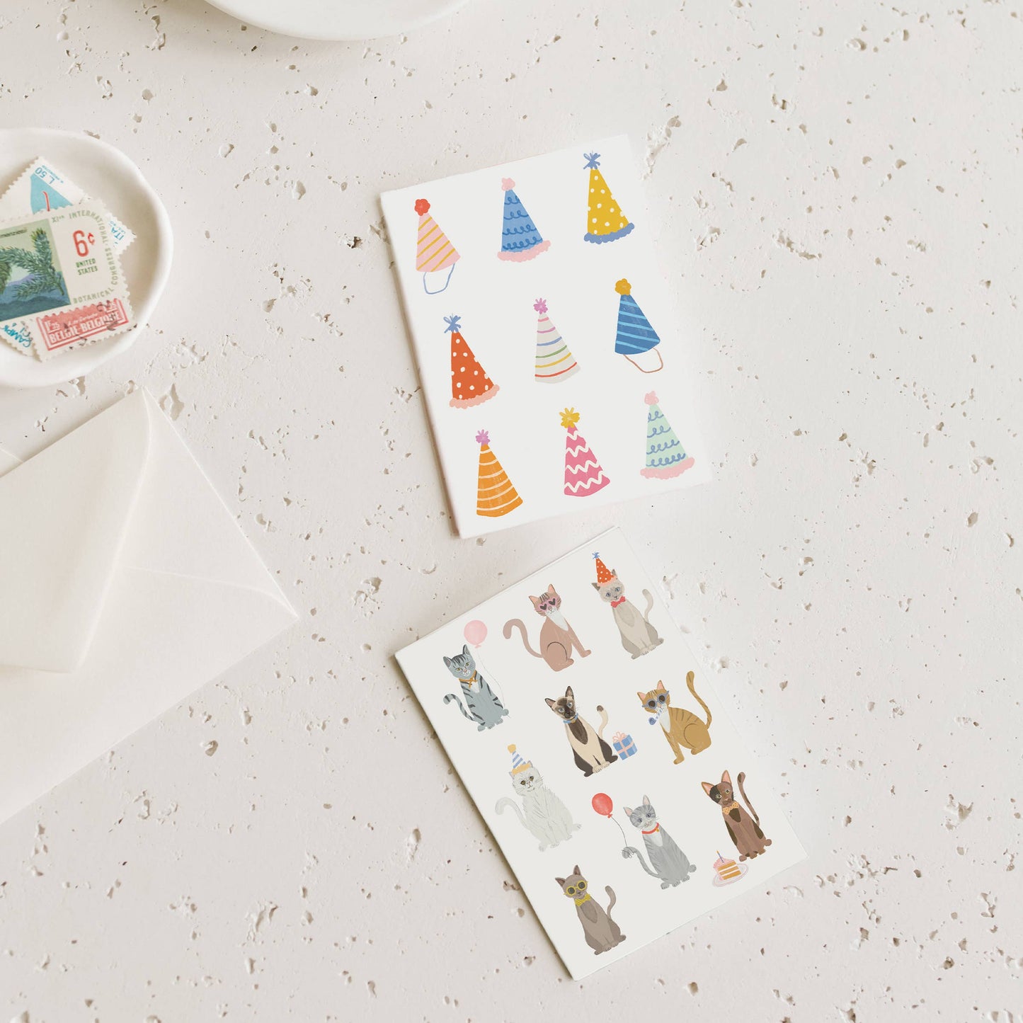 Mini greeting card with party-hat cats, colorful illustrations