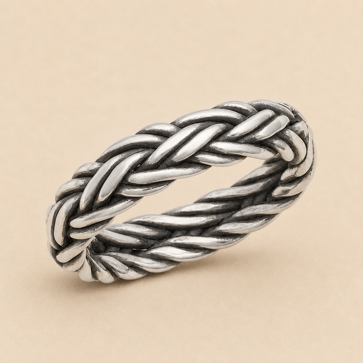 Braided band ring in silver-tone metal with twisted rope braid detail