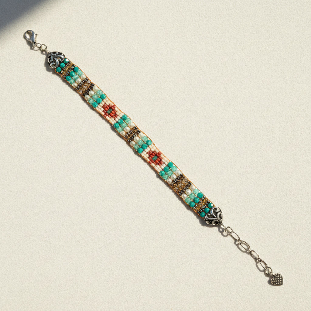 Multicolored beaded bracelet with metal clasp on a white background