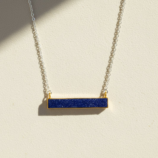 Two-tone druzy bar necklace with dark blue rectangular pendant on gold chain