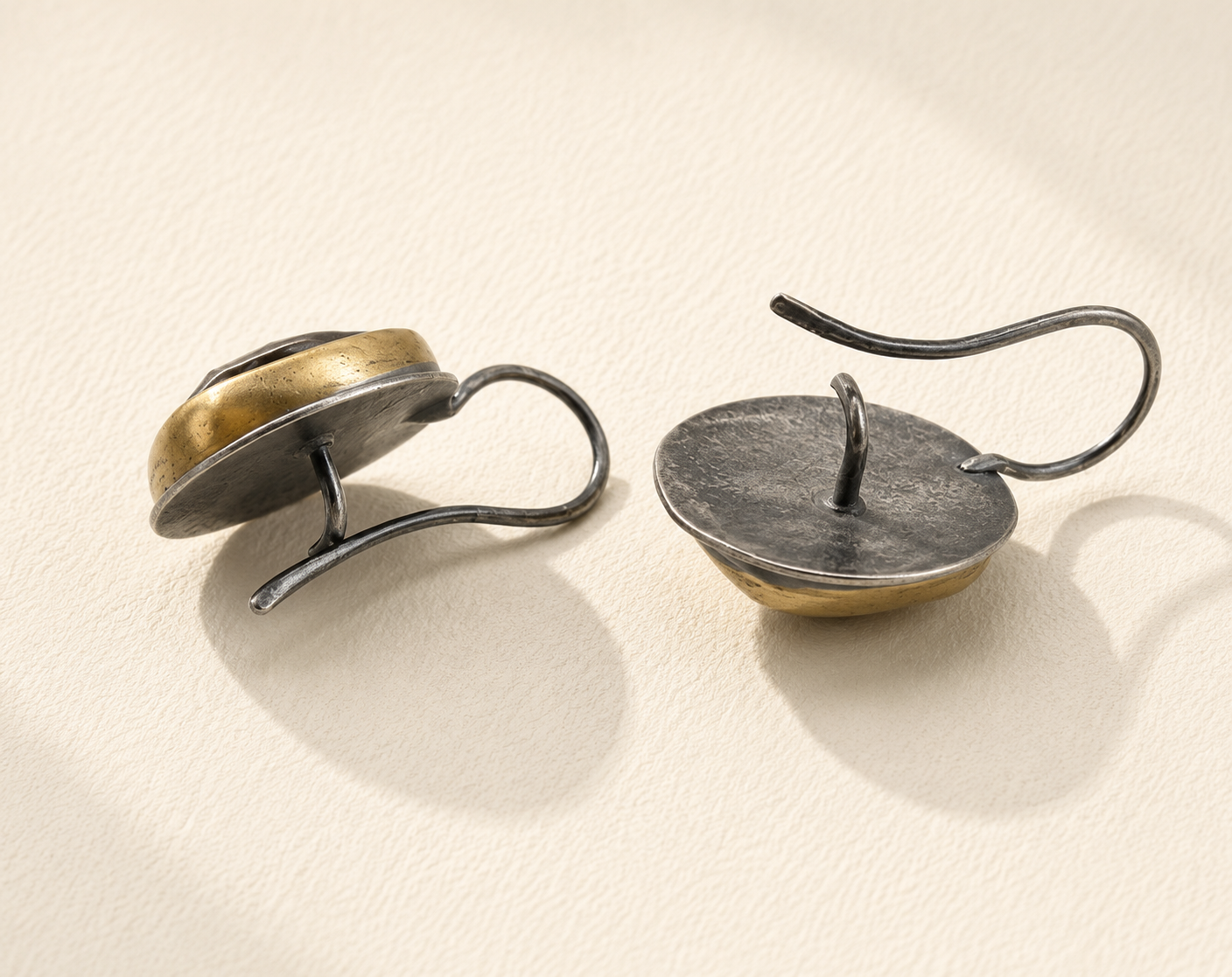 Crescent-rim hook earrings, silver-toned curved discs with gold-toned backs