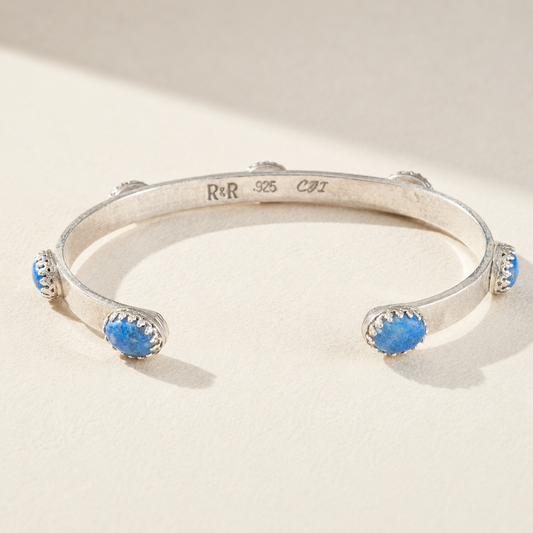 Silver cuff bracelet stamped 925 with two blue bead stones on open bangle