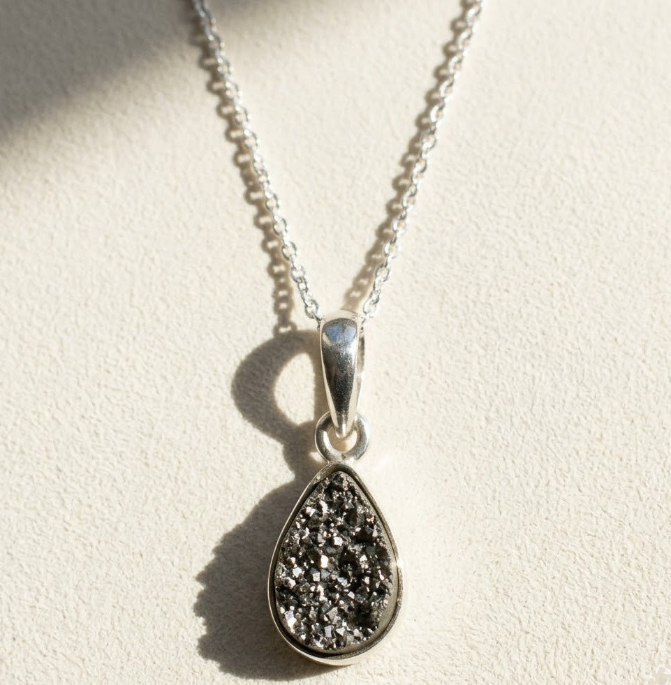 Silver-tone teardrop druzy pendant necklace with faceted sparkle-stone drop on chain