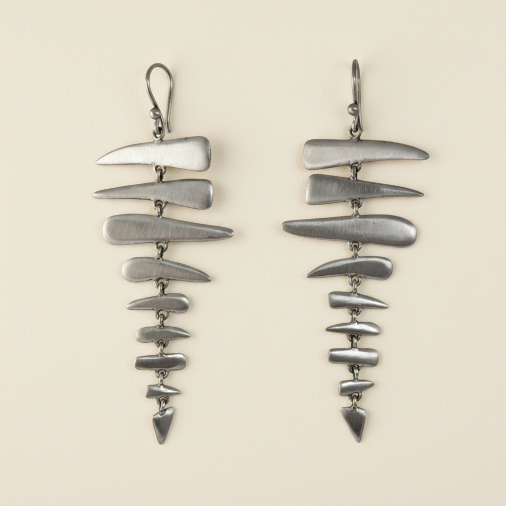 Large fishbone drop earrings with layered metallic gray curved pieces and fishhook backs