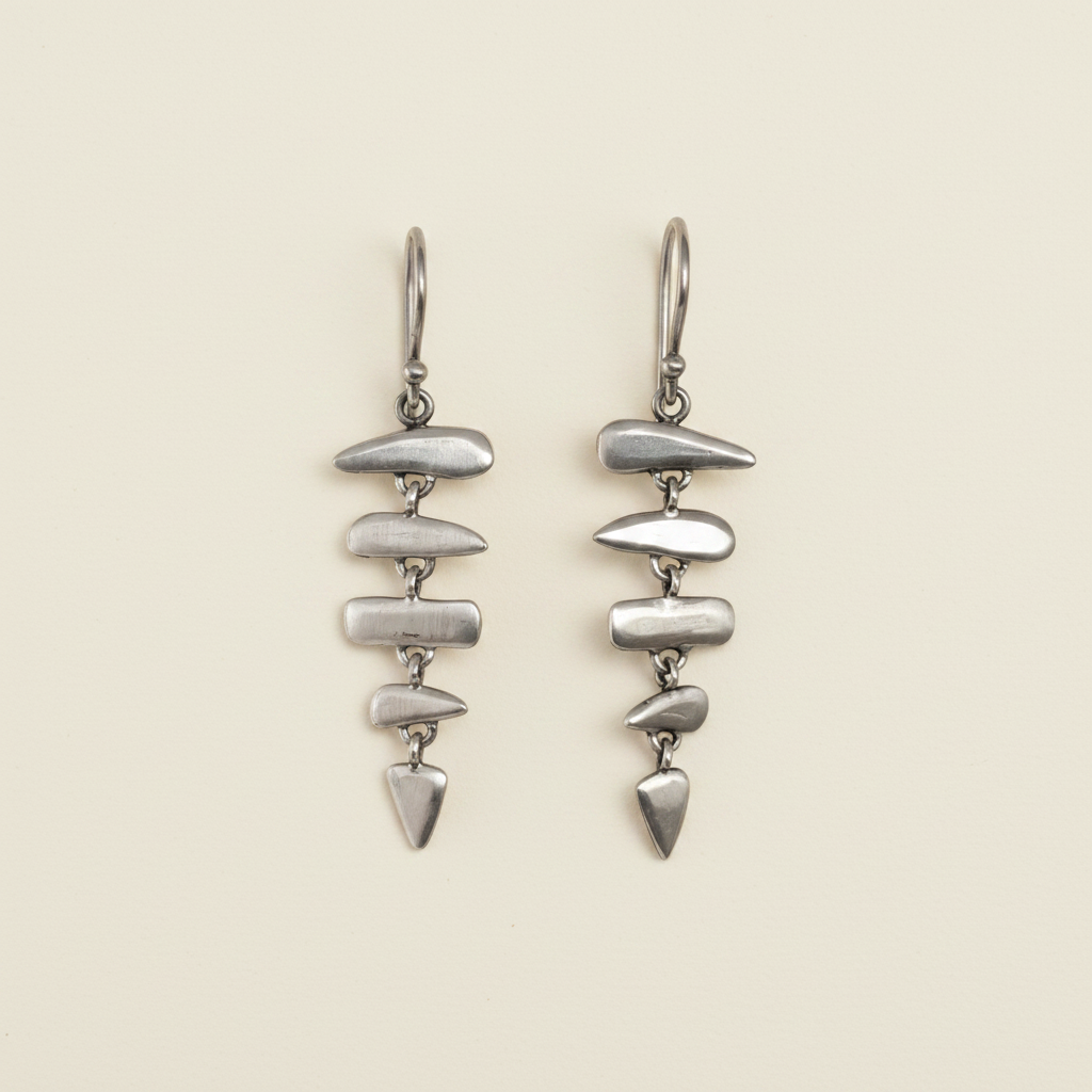 Silver-tone fishbone drop earrings with stacked leaf-shaped links and long hooks
