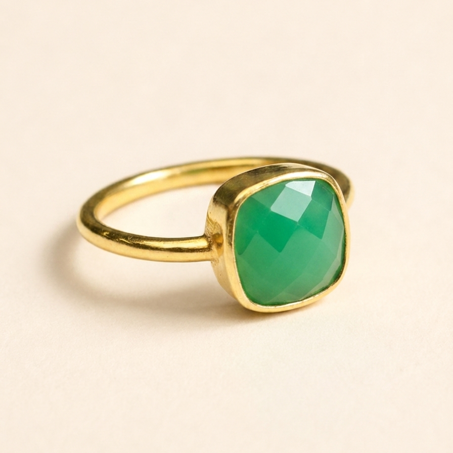 Gold-tone ring with faceted green chrysoprase cushion stone bezel setting
