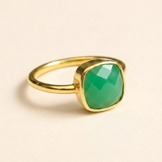 Gold-tone ring with faceted green chrysoprase cushion stone bezel setting