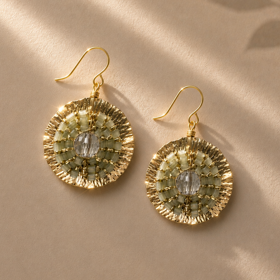 Gold-tone beaded medallion earrings with crystal center