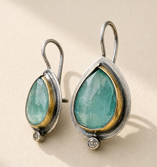 Teardrop rim drop earrings with green gemstone teardrops, gold-tone rim, and small crystal bead