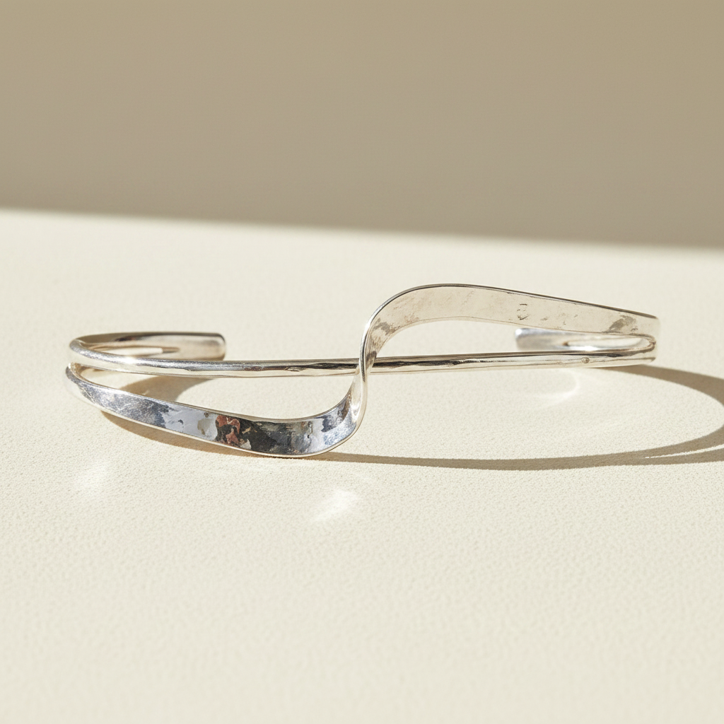 Silver hammered cuff bracelet with double wave design and open ends