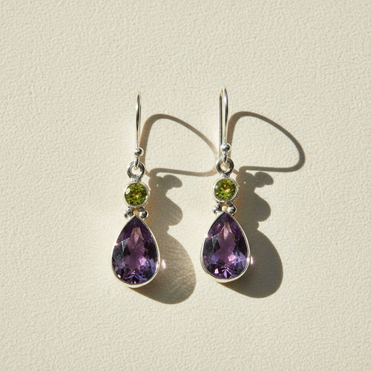 Silver-tone teardrop dangle earrings with green round and purple amethyst gems