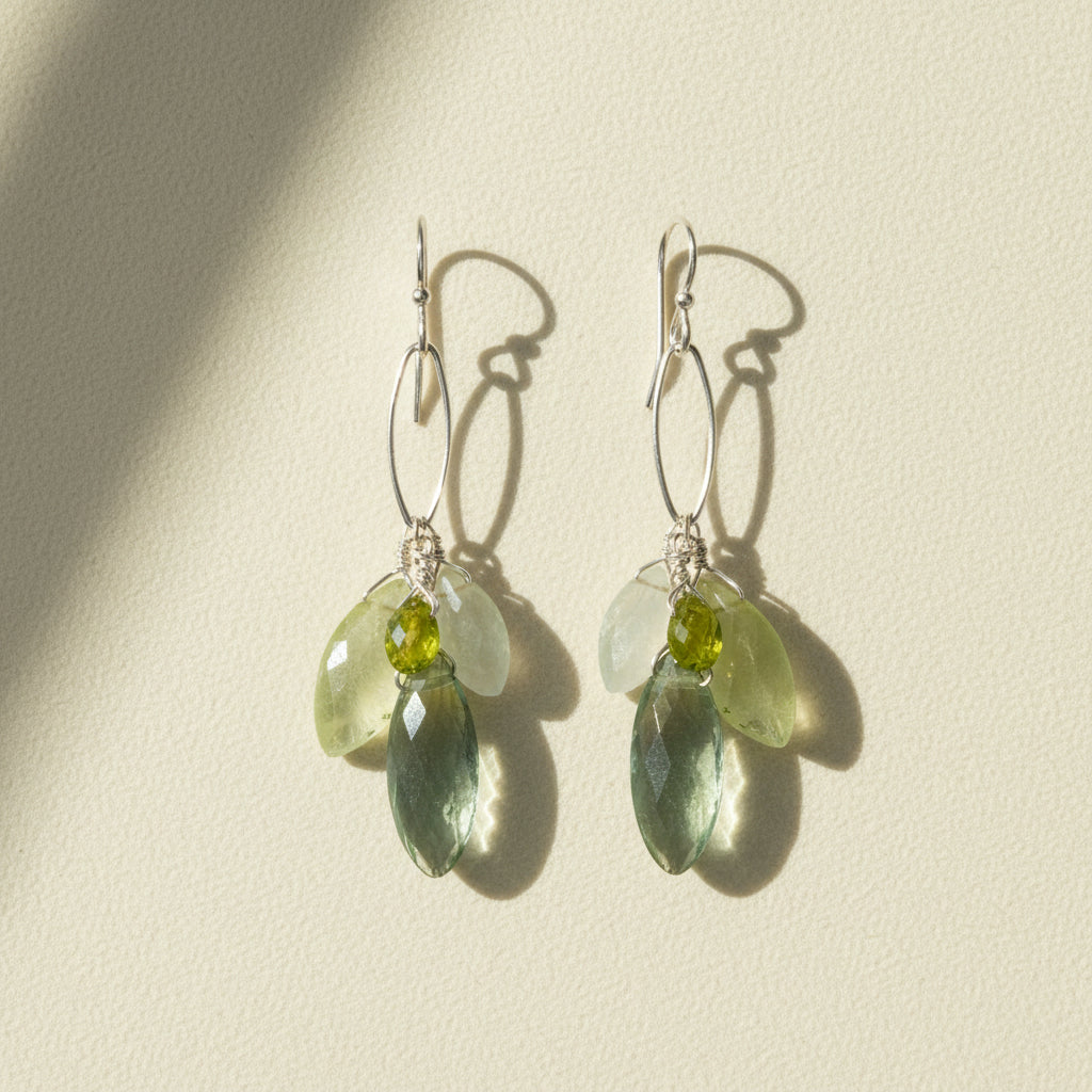 Silver hoop drop earrings with clustered green gemstones, teardrop and oval shapes