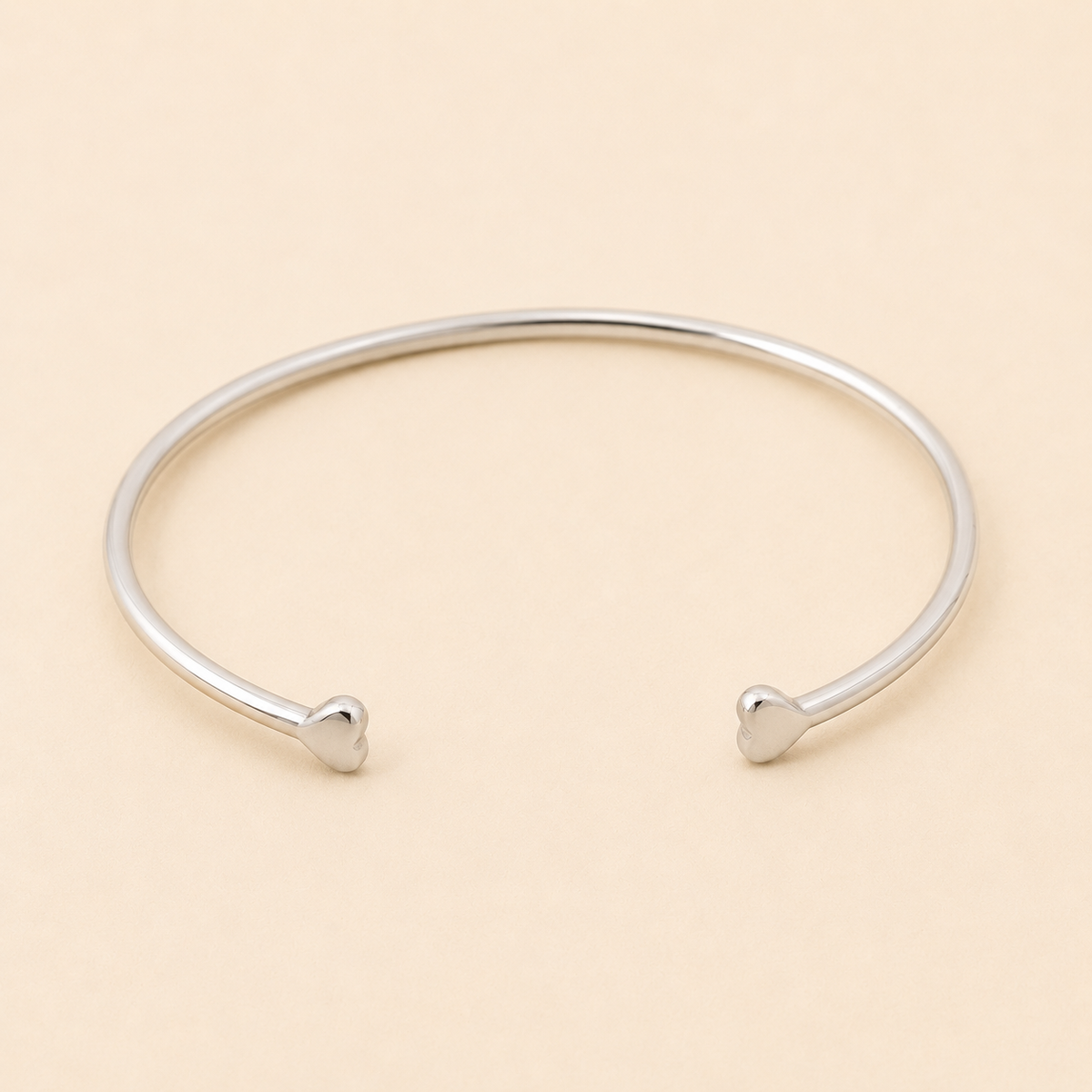 Silver-tone double heart cuff bracelet with two heart-shaped ends