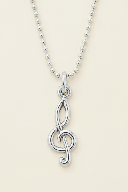 Silver-tone treble clef charm pendant on beaded chain with raised loop detail