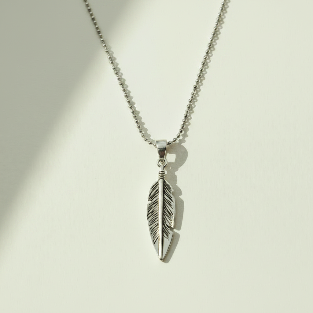 Oxidized feather pendant necklace with silver-tone feather charm and loop bail
