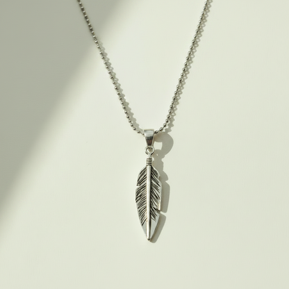 Oxidized feather pendant necklace with silver-tone feather charm and loop bail