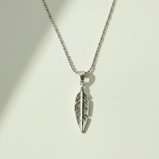 Oxidized feather pendant necklace with silver-tone feather charm and loop bail