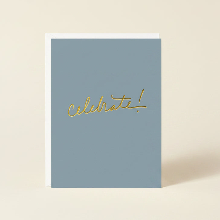 Blue card with 'Celebrate!' in gold on a white background