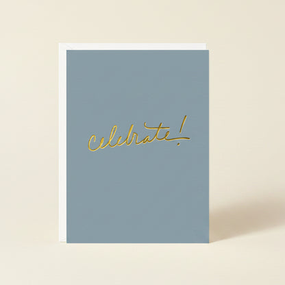 Blue card with 'Celebrate!' in gold on a white background