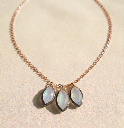 Moonstone petal drop necklace with gold chain and three oval stones
