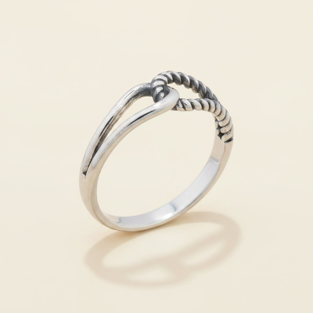 Silver-tone interlocking loops ring with braided loop detail, smooth band