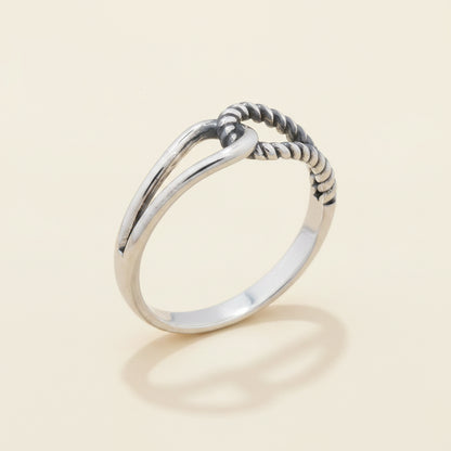 Silver-tone interlocking loops ring with braided loop detail, smooth band
