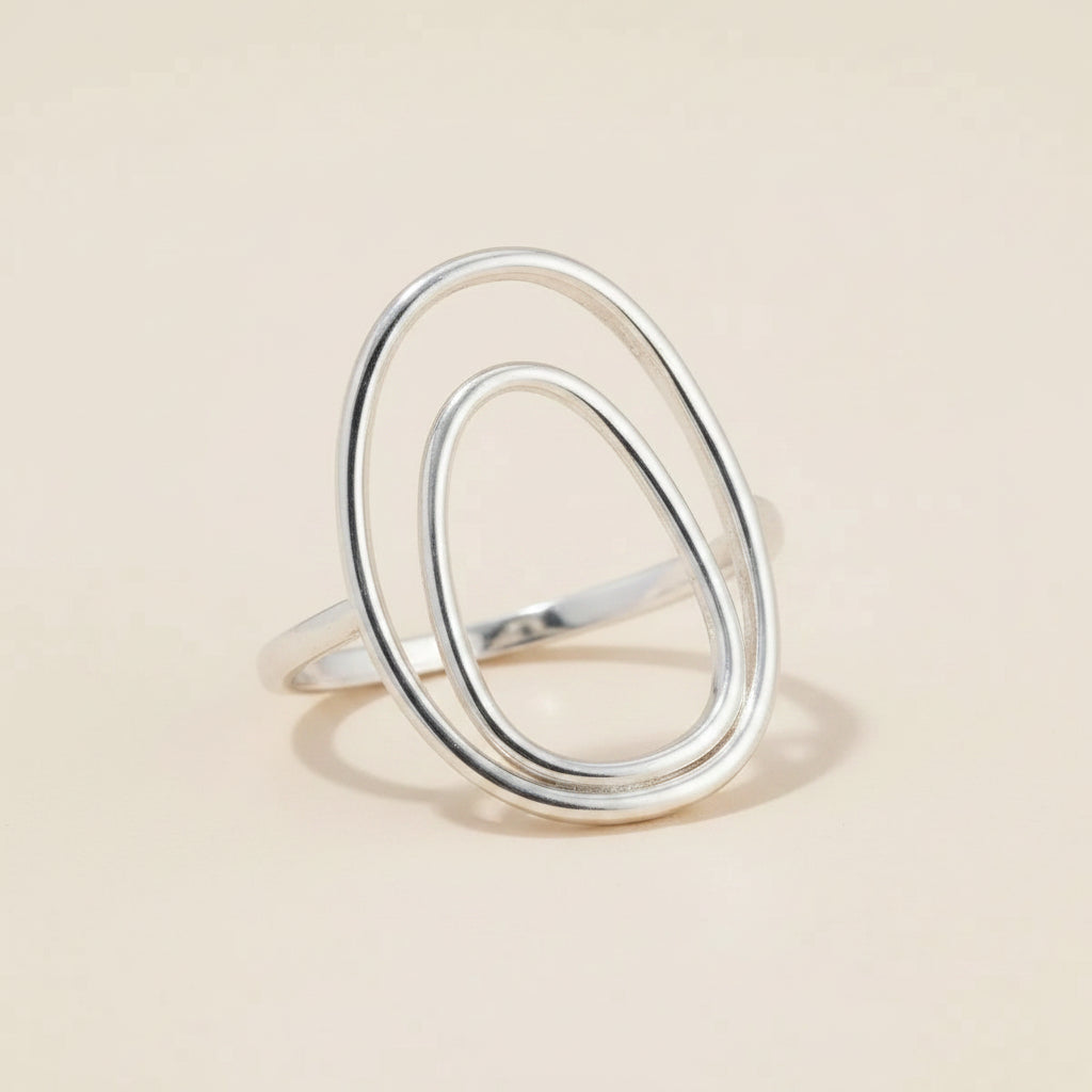 Silver double oval ring with two stacked teardrop-shaped bands