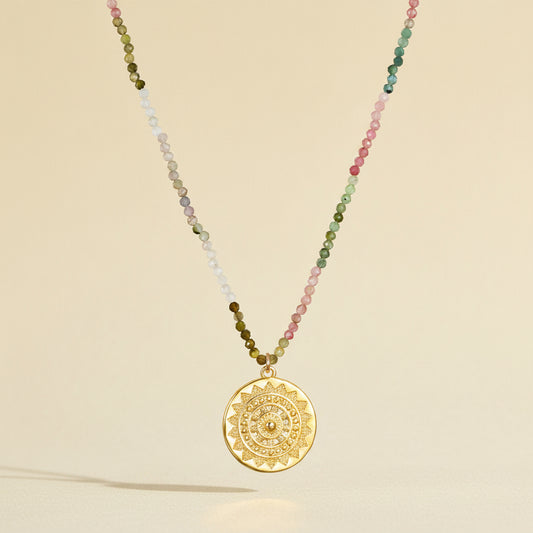 Tourmaline medallion necklace with multicolor beaded strand and round gold engraved pendant