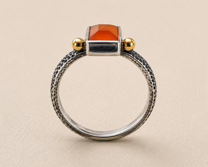 Front view carnelian orange stone ring with textured silver hoop and gold top posts