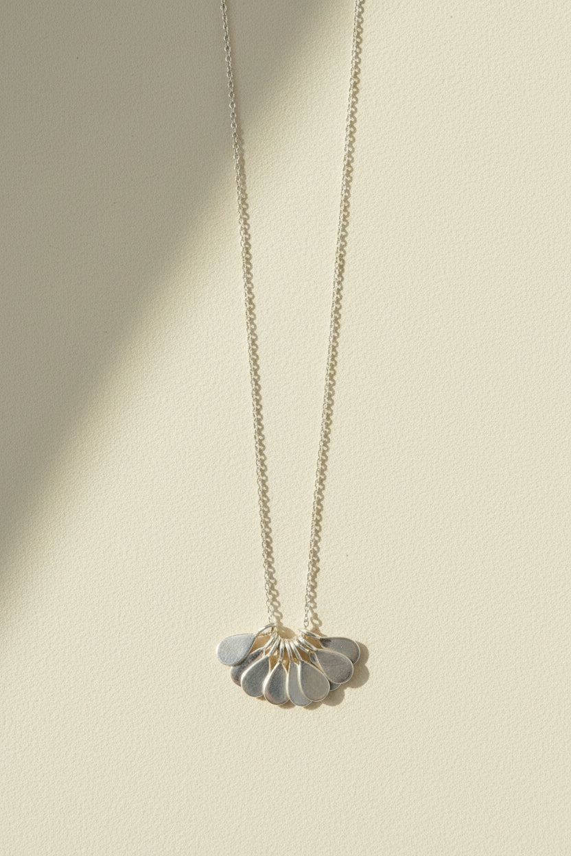 Silver teardrop flower pendant necklace with thin chain