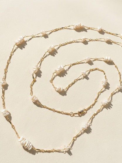 Gold-tone necklace with keshi pearls and linked drops, shown in three lengths