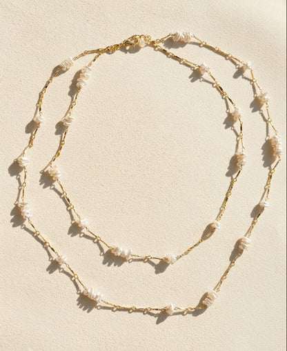 Gold-tone keshi pearl chain necklace with layered drape of shell drops