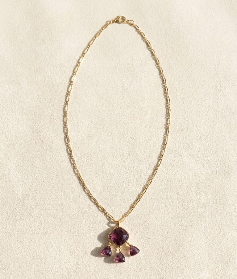 Gold-tone briolette necklace with teardrop purple gemstone pendant