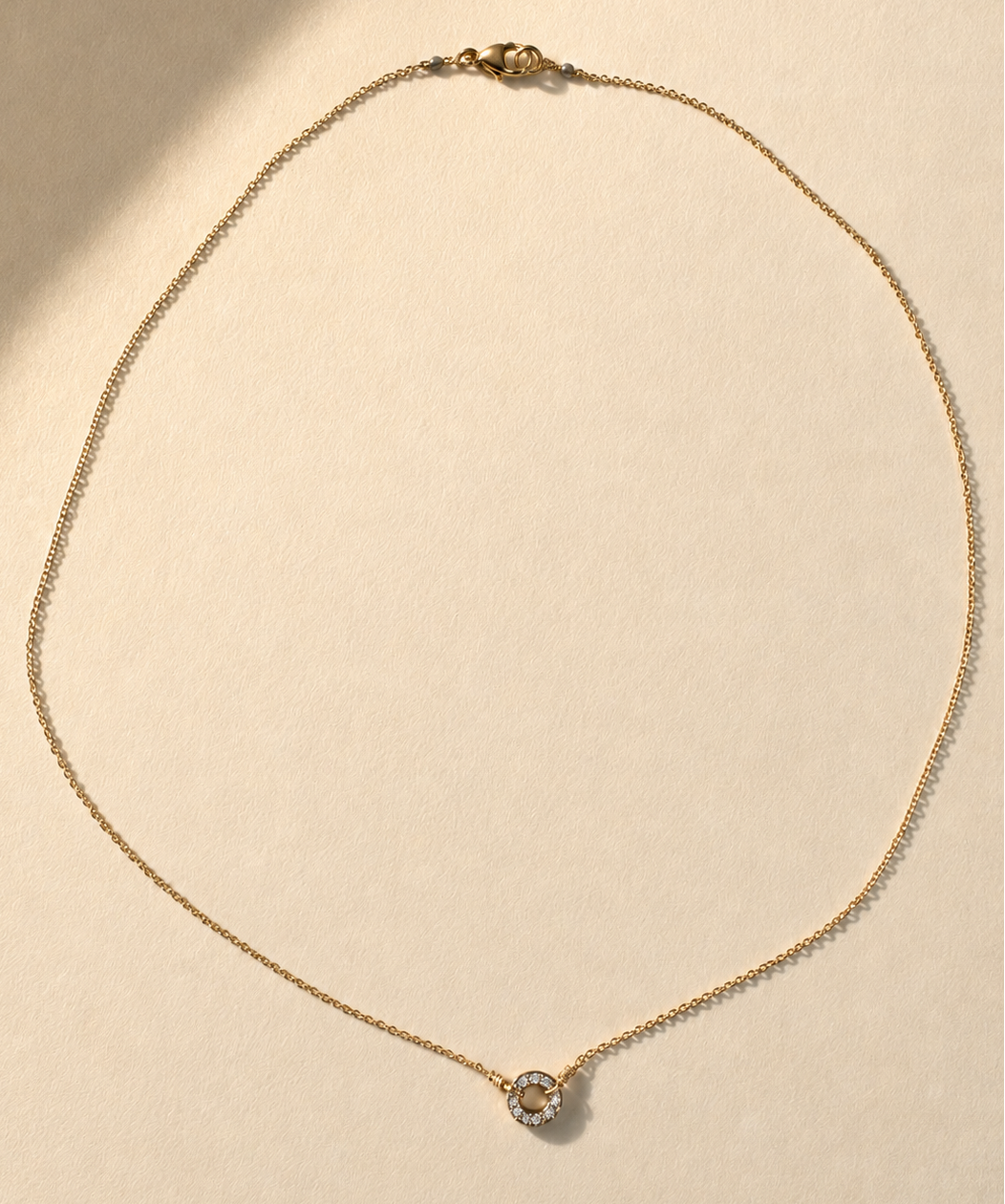 Gold necklace with pavé circle pendant