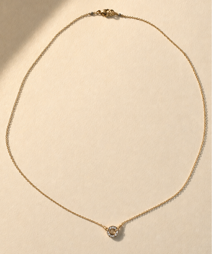 Gold necklace with pavé circle pendant