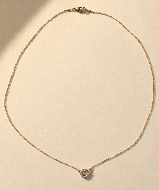 Gold necklace with pavé circle pendant